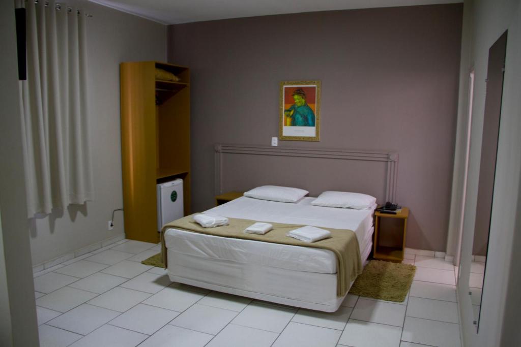 Postel nebo postele na pokoji v ubytování Presidente Hotel