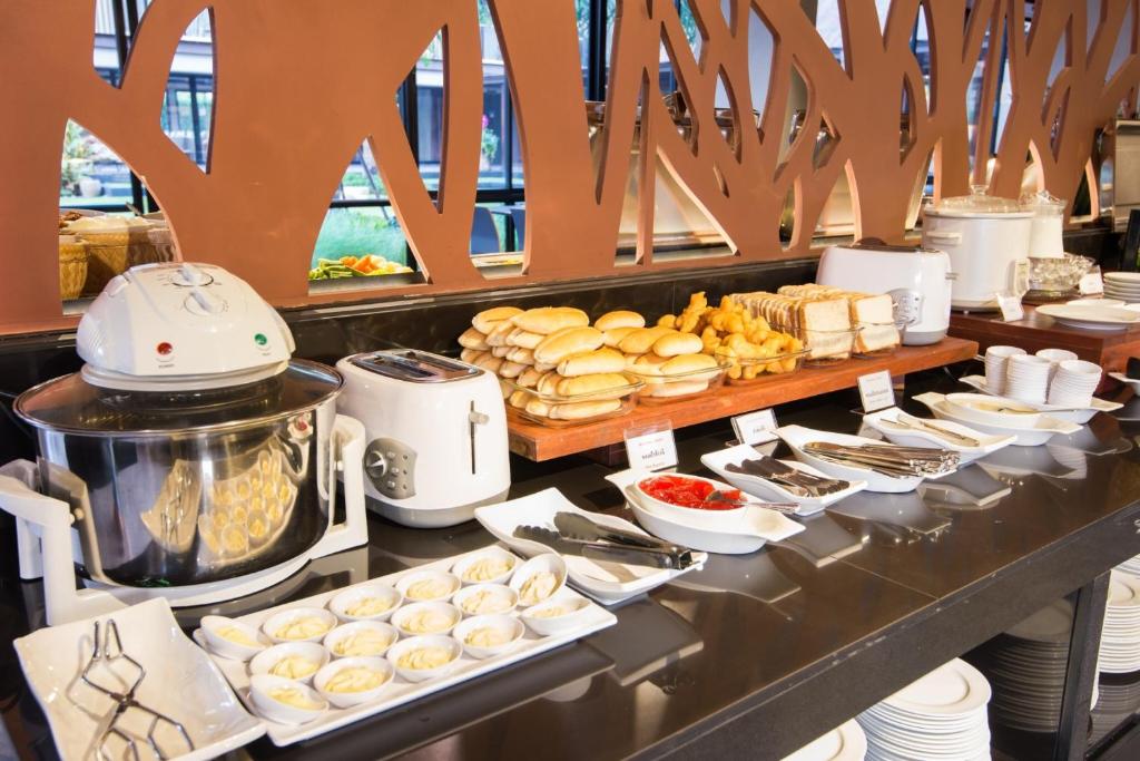 a buffet line with food on a table at Amanta Hotel Nongkhai in Nong Khai