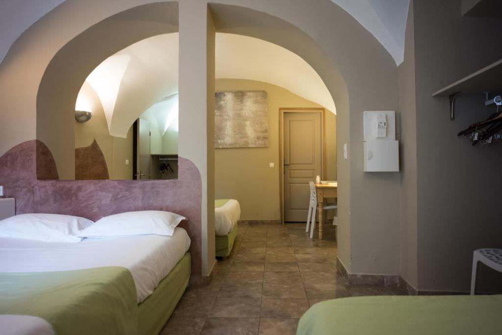 Postel nebo postele na pokoji v ubytování Sud Hôtel Restaurant