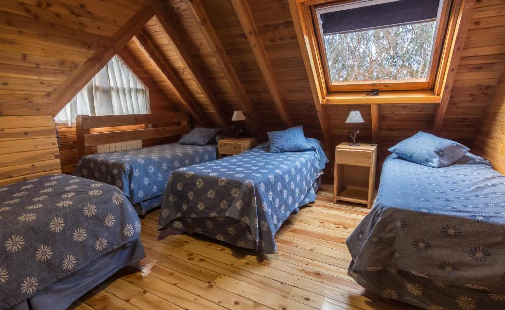 Postel nebo postele na pokoji v ubytování Cabañas Las Marias Del Nahuel
