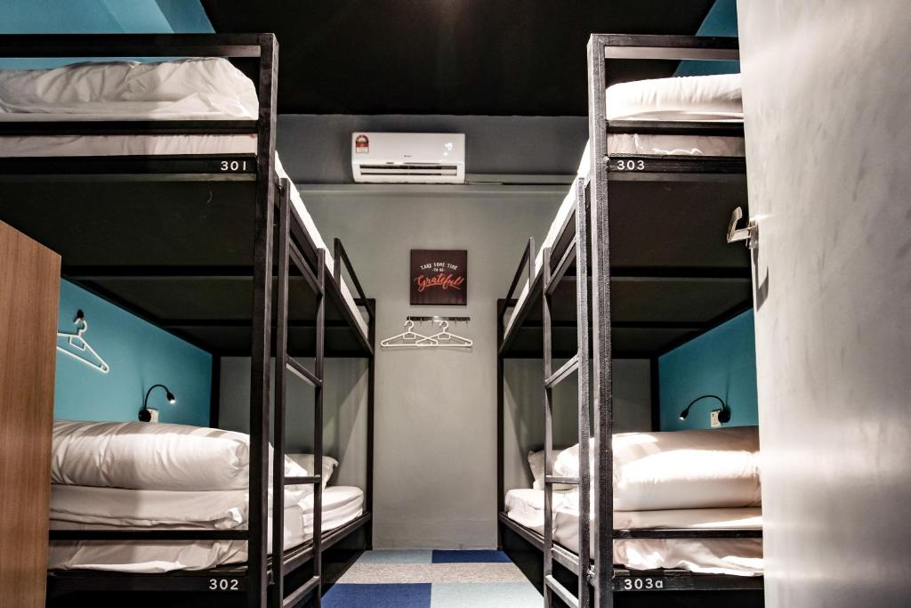 Postel nebo postele na pokoji v ubytování Vibrant Hostel