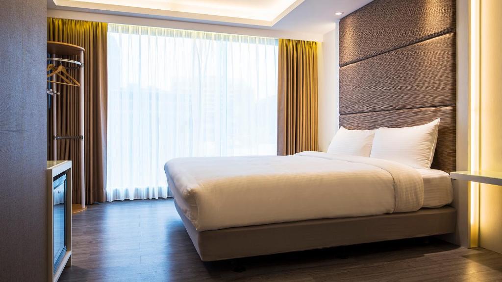Golden Garden Hotelにあるベッド