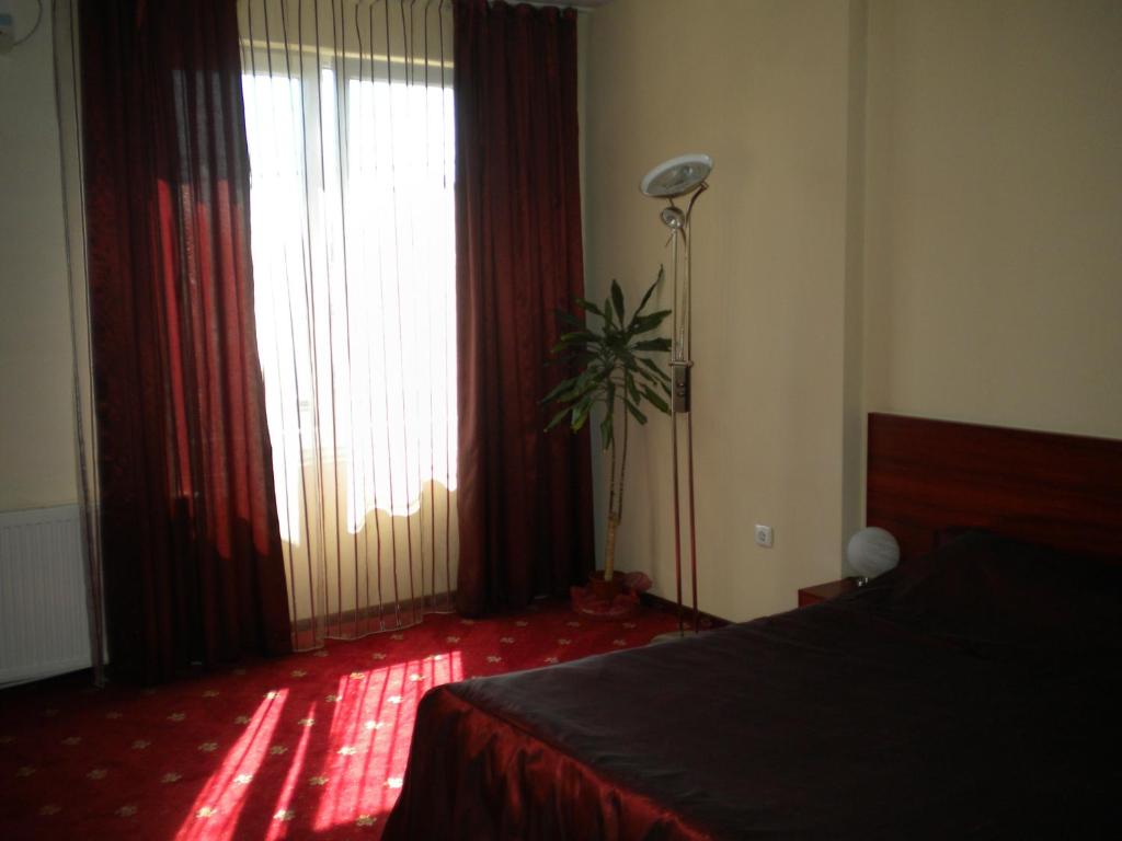 Postel nebo postele na pokoji v ubytování Hotel Ary