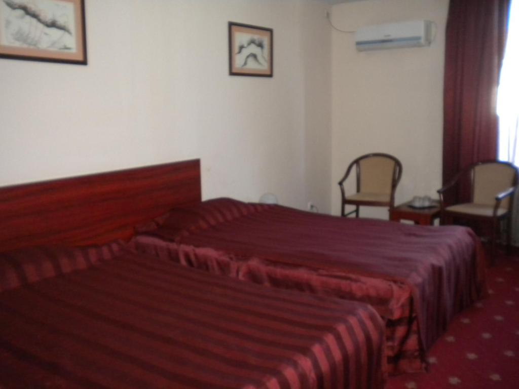 Postel nebo postele na pokoji v ubytování Hotel Ary