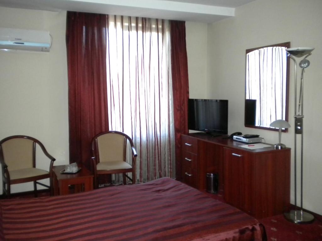 TV a/nebo společenská místnost v ubytování Hotel Ary