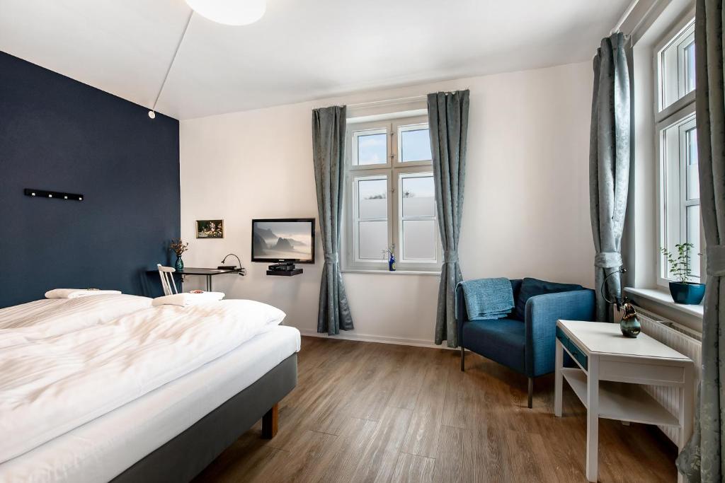 Postel nebo postele na pokoji v ubytování Årslev B&B