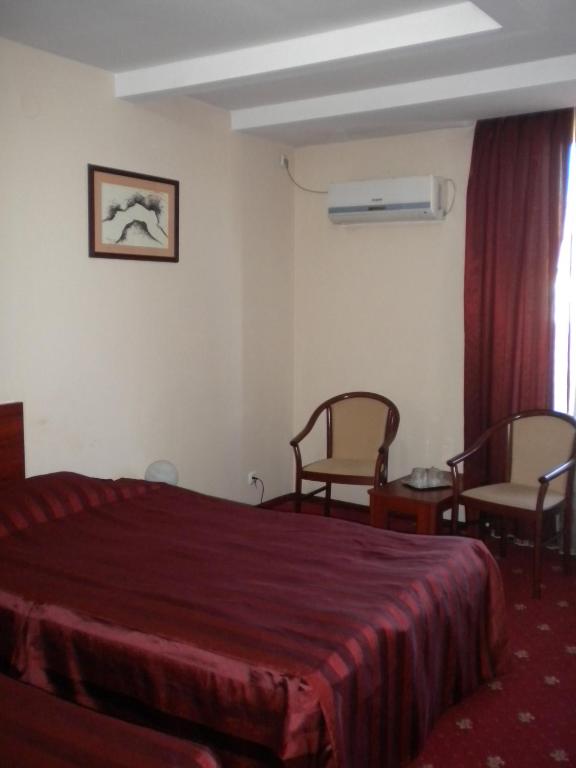 Postel nebo postele na pokoji v ubytování Hotel Ary