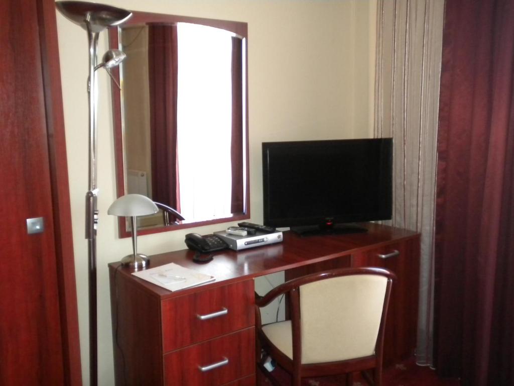 TV a/nebo společenská místnost v ubytování Hotel Ary