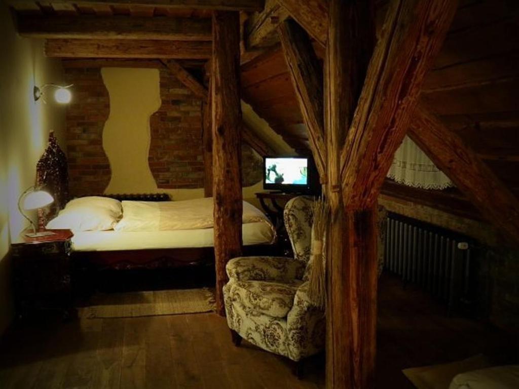 Postel nebo postele na pokoji v ubytování Dvůr Olšiny -Hotel and Horse-riding