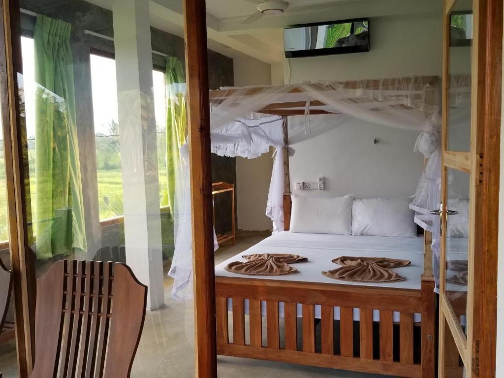 Postel nebo postele na pokoji v ubytování Nelu Villa Sigiriya