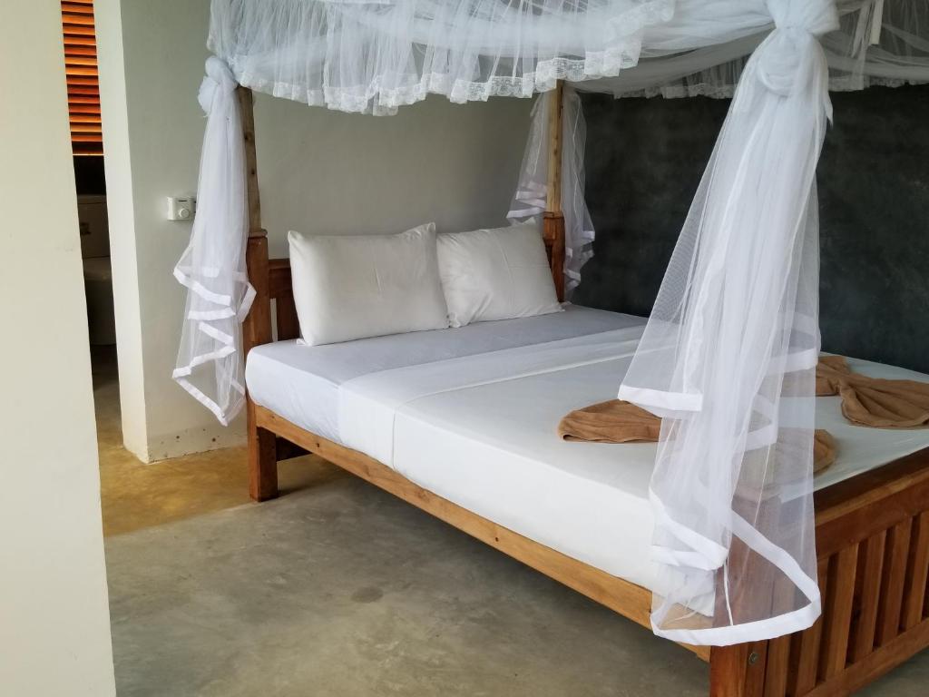 Postel nebo postele na pokoji v ubytování Nelu Villa Sigiriya