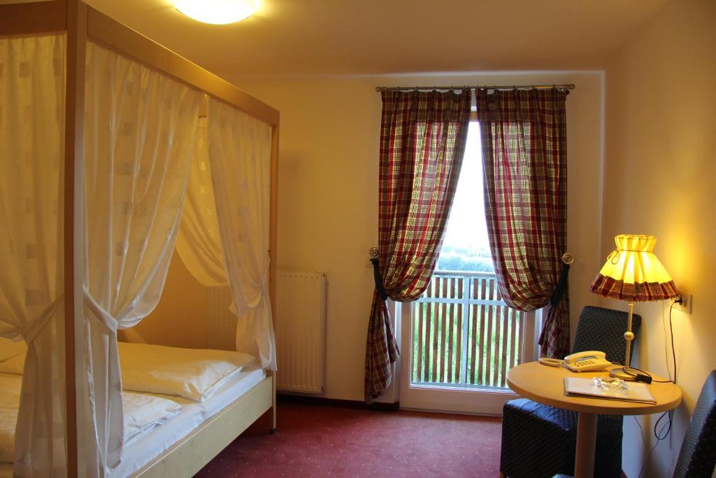 Postel nebo postele na pokoji v ubytování Hotel Hanny