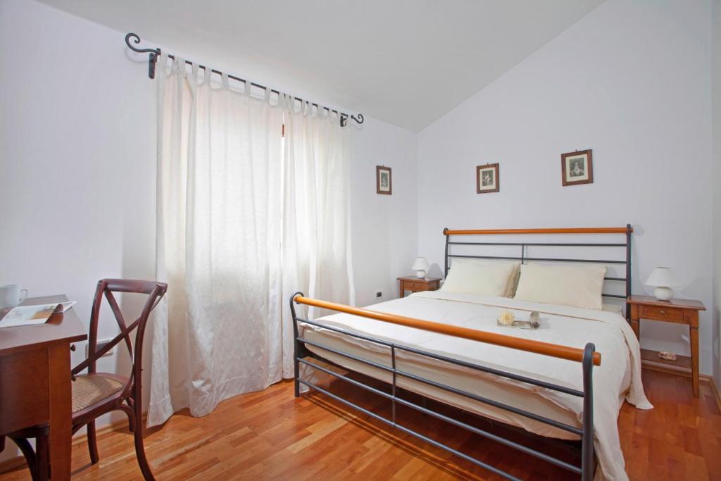 Postel nebo postele na pokoji v ubytování Villa Aurata in Ližnjan (Haus für 8-9 Personen)