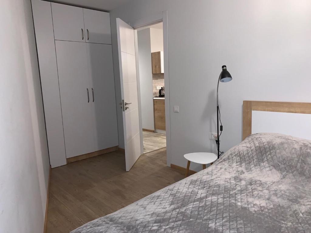 Postel nebo postele na pokoji v ubytování Сozy 2 Room apart NEW GUDAURI, LOFT 2, apt 252