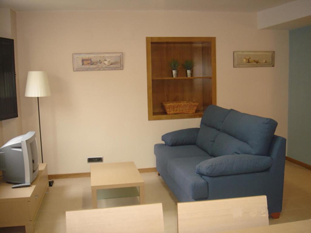 A television and/or entertainment centre at Apartamentos San Cristobal