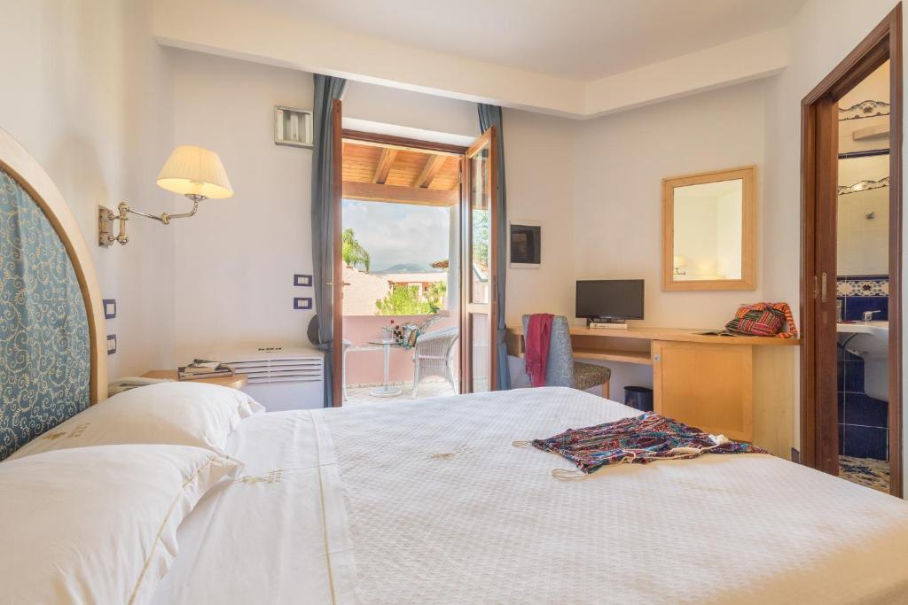 Postel nebo postele na pokoji v ubytování Hotel Eros