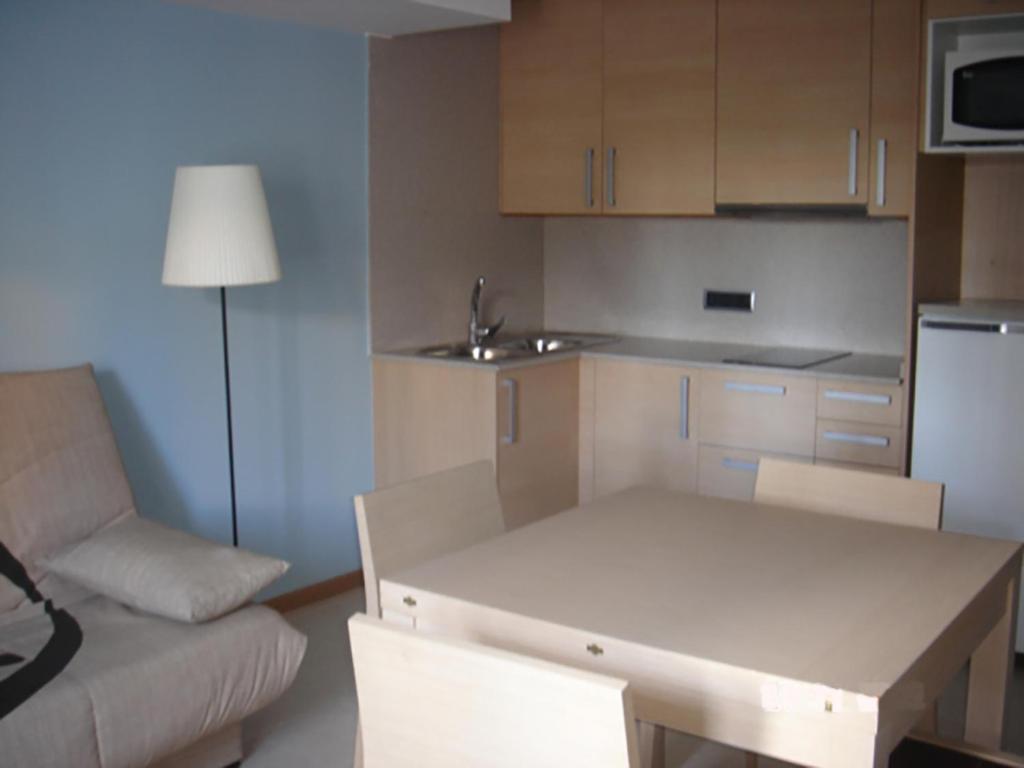 A kitchen or kitchenette at Apartamentos San Cristobal