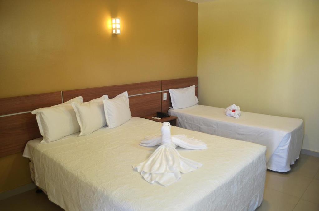 Postel nebo postele na pokoji v ubytování Pontal Praia Hotel