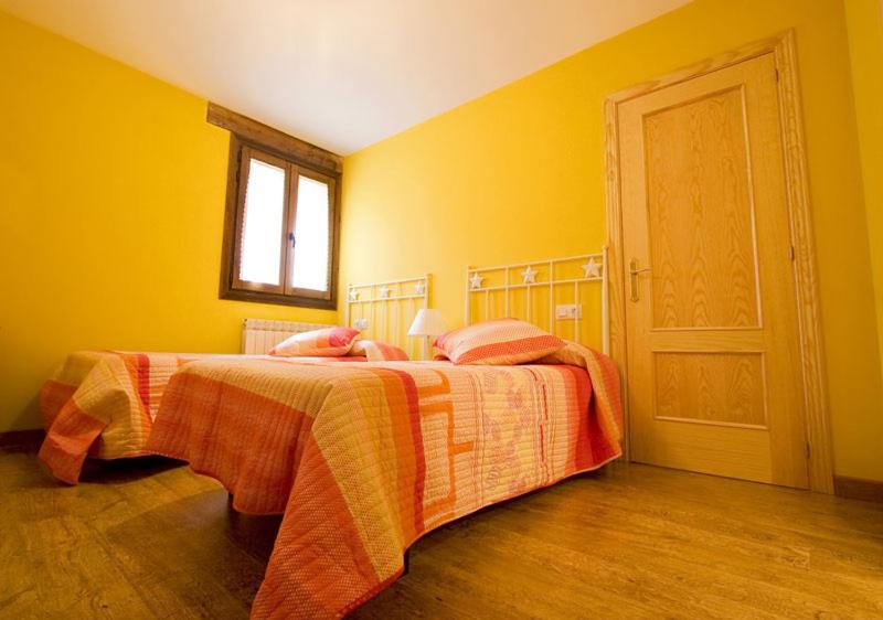 Postel nebo postele na pokoji v ubytování Apartamentos Cañardo Autural