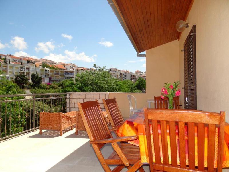 a patio with a table and chairs on a balcony at Apartments Ivanka in Hvar