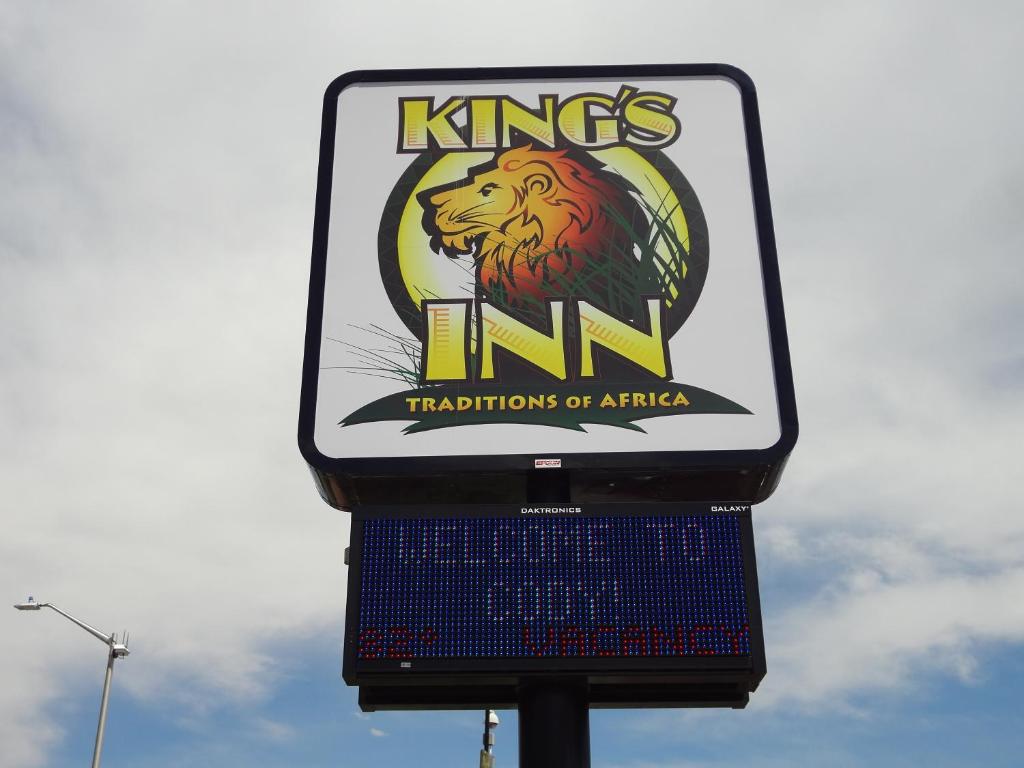 a sign for the kings inn transitions of africa at Kings Inn Cody in Cody