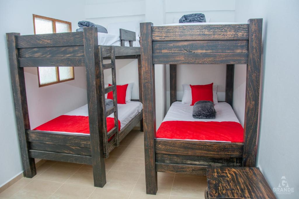 Postel nebo postele na pokoji v ubytování Hotel Madre Laura Jericó