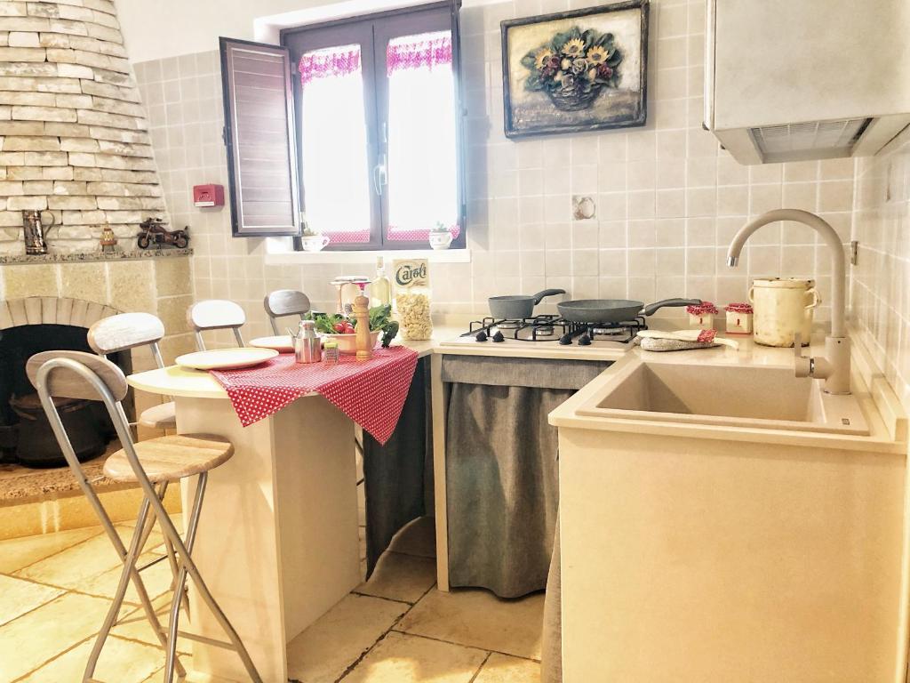 Kjøkken eller kjøkkenkrok på Trulli Caroli