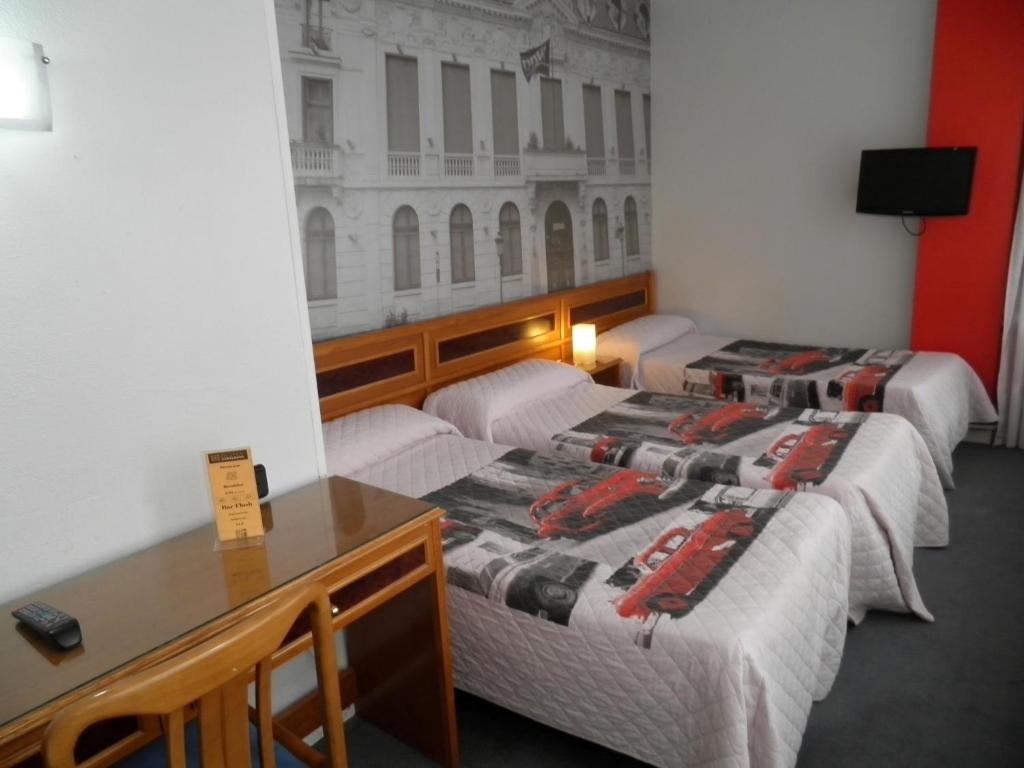 Postel nebo postele na pokoji v ubytování Hotel Photo Zabalburu