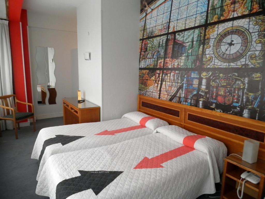 Postel nebo postele na pokoji v ubytování Hotel Photo Zabalburu