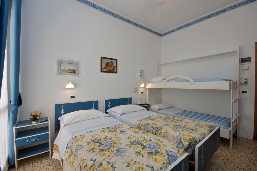 Postel nebo postele na pokoji v ubytování Hotel Victory