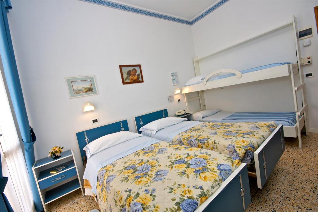 Postel nebo postele na pokoji v ubytování Hotel Victory