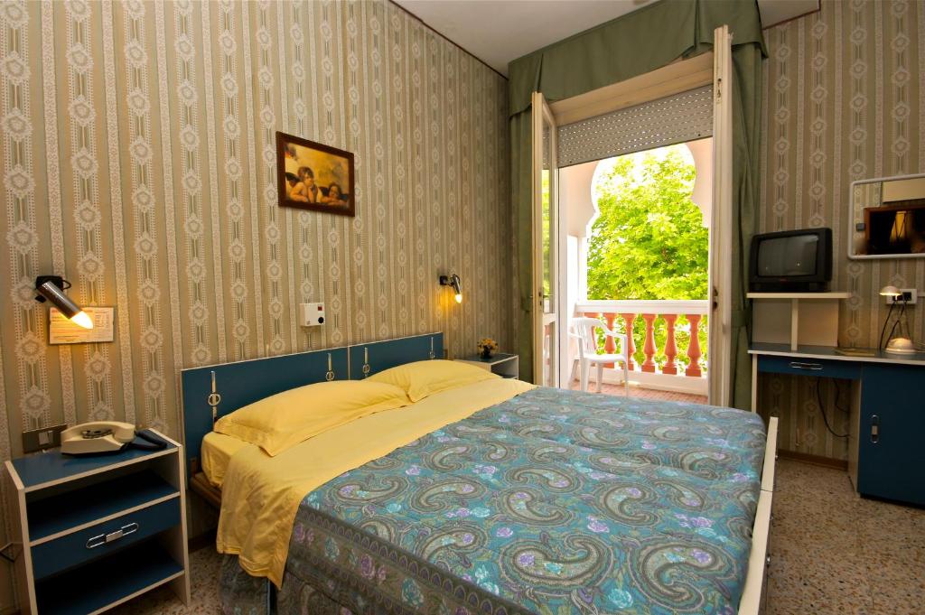 Postel nebo postele na pokoji v ubytování Hotel Victory