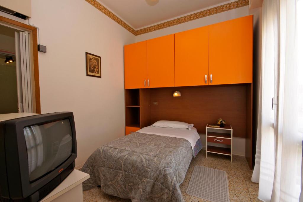 Postel nebo postele na pokoji v ubytování Hotel Victory