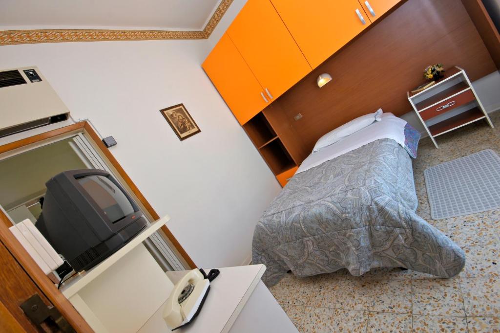 Postel nebo postele na pokoji v ubytování Hotel Victory