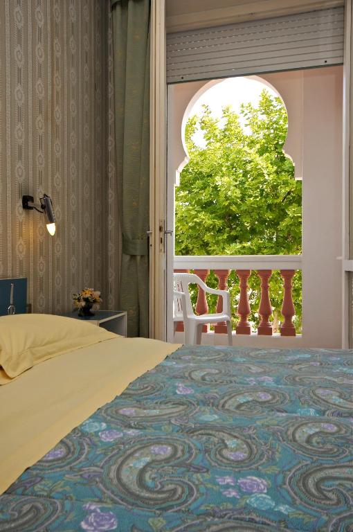 Postel nebo postele na pokoji v ubytování Hotel Victory