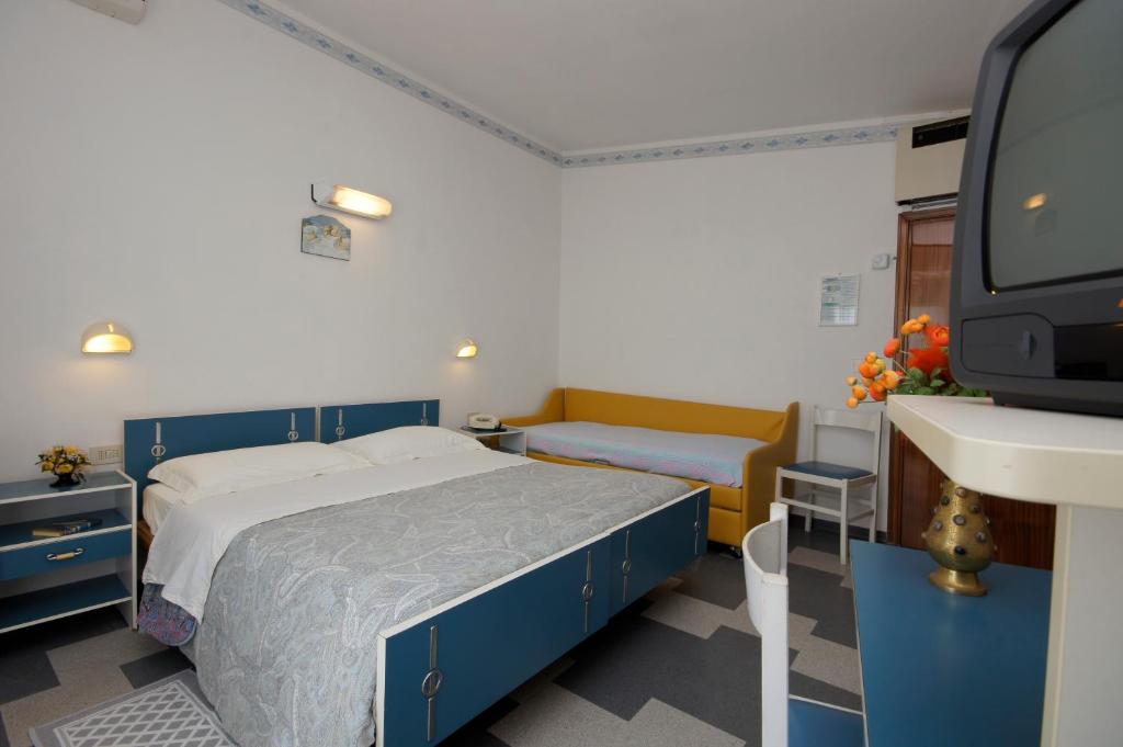 Postel nebo postele na pokoji v ubytování Hotel Victory