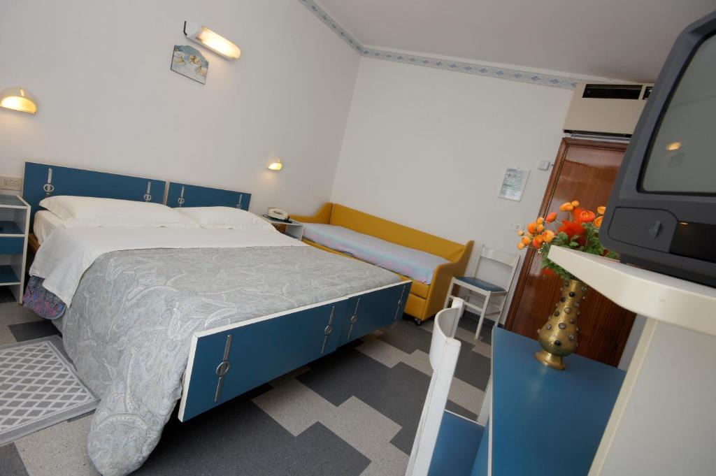 Postel nebo postele na pokoji v ubytování Hotel Victory