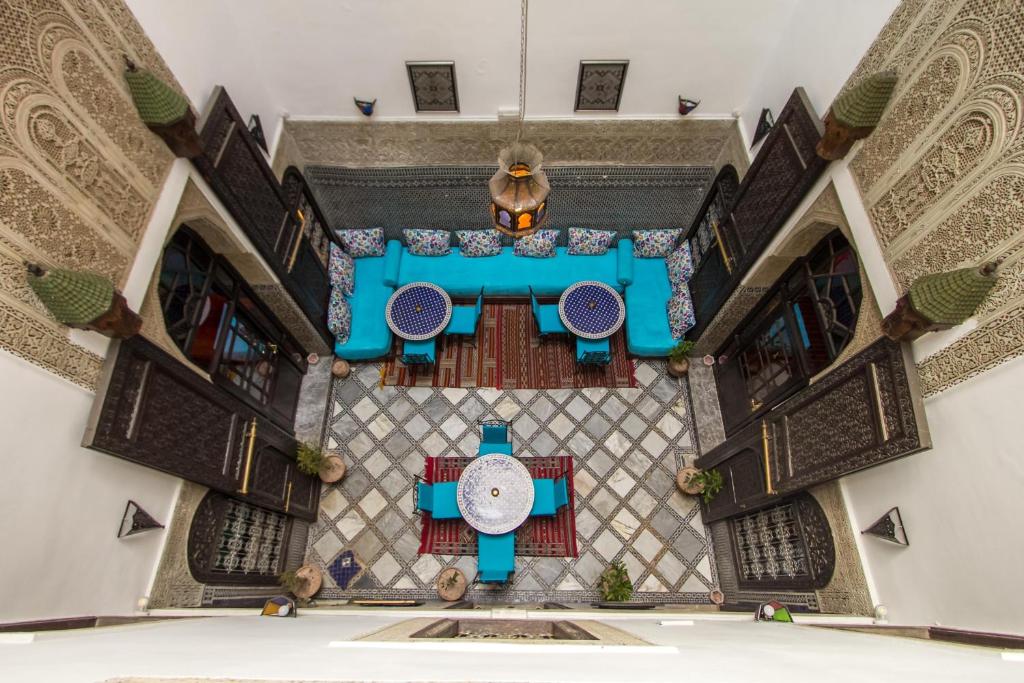 an overhead view of a dining room in a building at Riad Hala in Fès