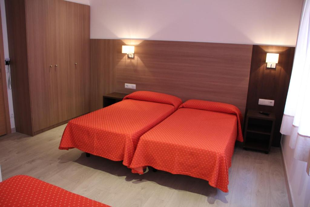 Postel nebo postele na pokoji v ubytování Hotel Victoria
