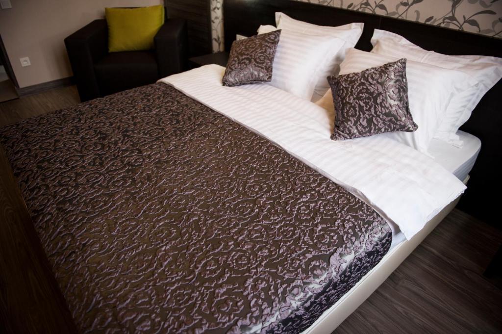 Postel nebo postele na pokoji v ubytování Boutique Apart - Hotel iArcadia
