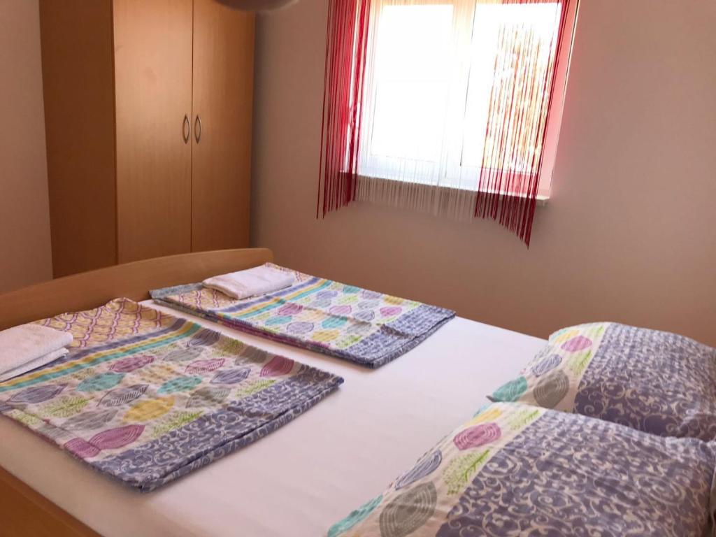 Postel nebo postele na pokoji v ubytování Guesthouse Pejo