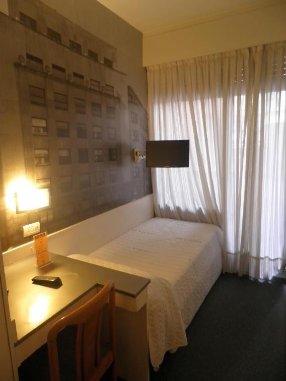 Postel nebo postele na pokoji v ubytování Hotel Photo Zabalburu