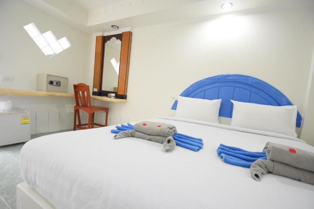 Postel nebo postele na pokoji v ubytování Simple Life Talay & Divers Resort