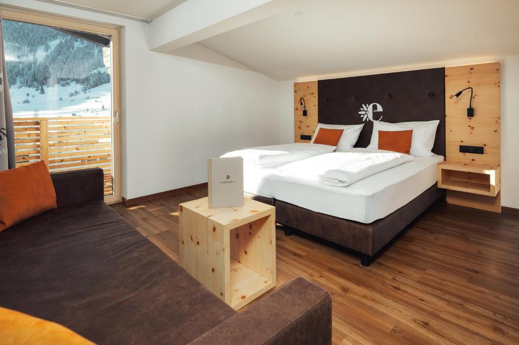 Posteľ alebo postele v izbe v ubytovaní Hotel Edelweiss Superior