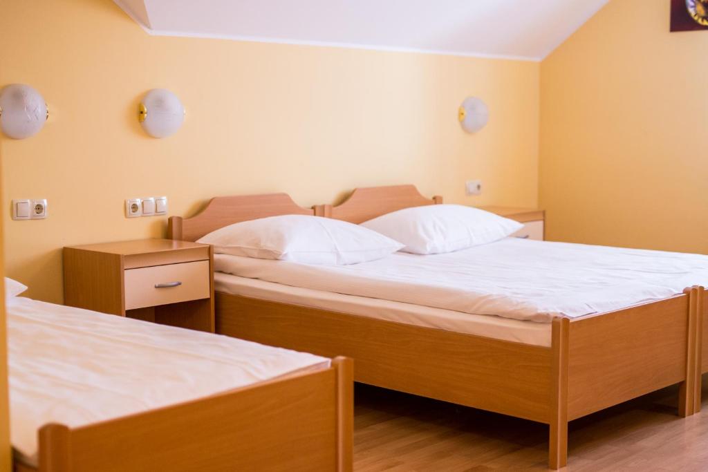 Postel nebo postele na pokoji v ubytování Guesthouse Beno