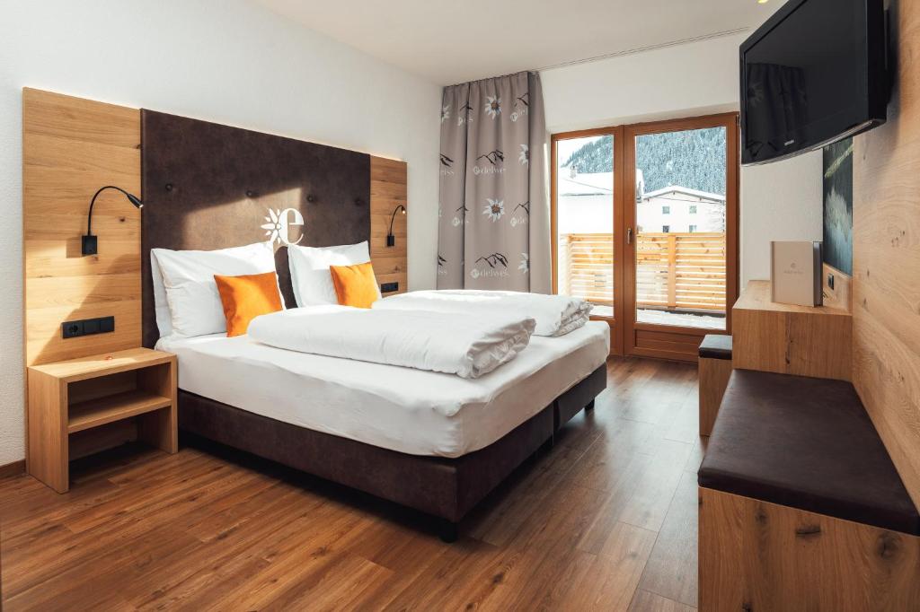 Posteľ alebo postele v izbe v ubytovaní Hotel Edelweiss Superior