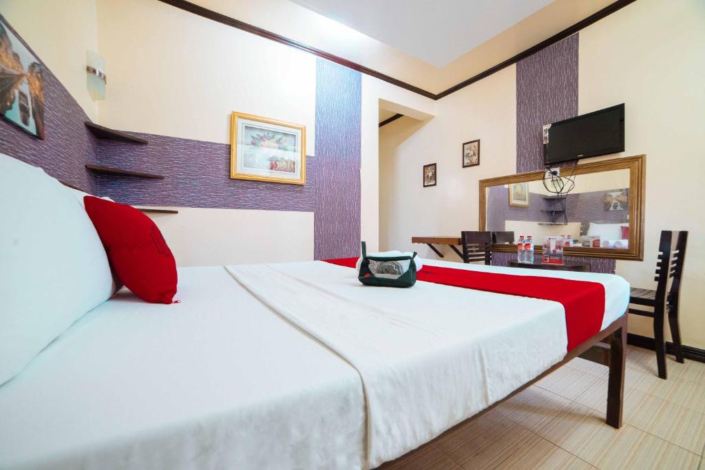 Postel nebo postele na pokoji v ubytování RedDoorz at Tagaytay Road