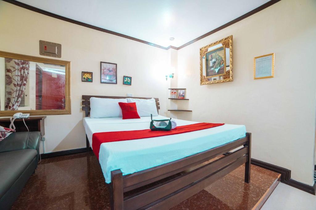 Postel nebo postele na pokoji v ubytování RedDoorz at Tagaytay Road