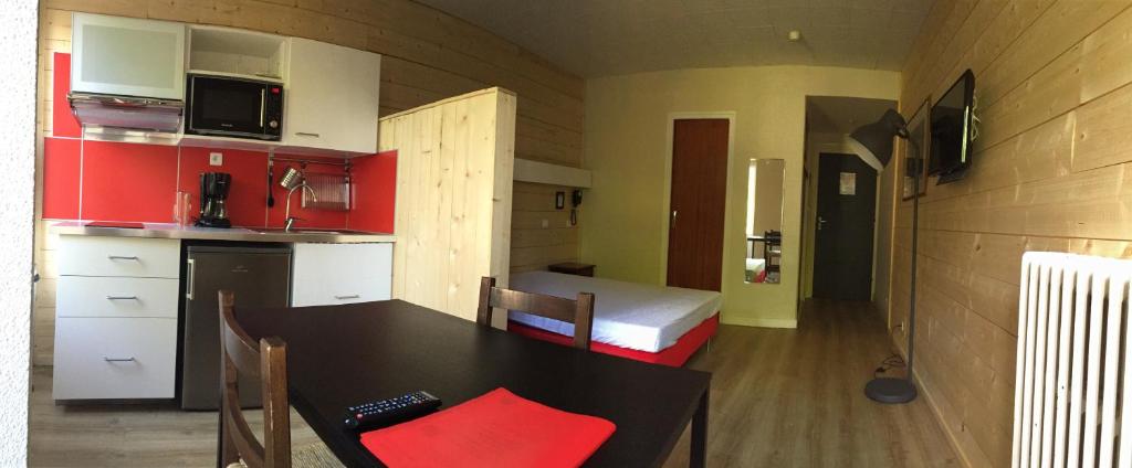 Kuchyň nebo kuchyňský kout v ubytování Aparthotel Le Petit Train