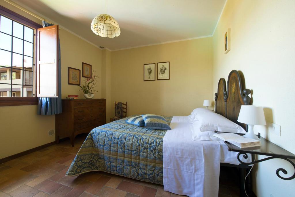 A bed or beds in a room at Borgo Filicardo